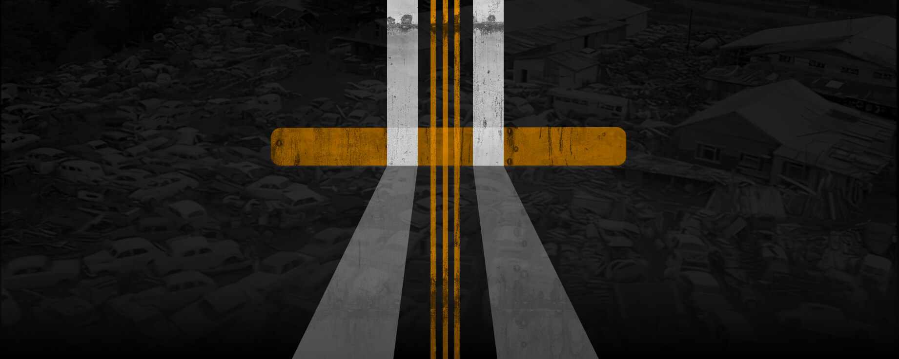 Abstract artwork of a road intersection forming a cross, with bold yellow and white road markings over a dark background of old cars and scrapyard buildings.